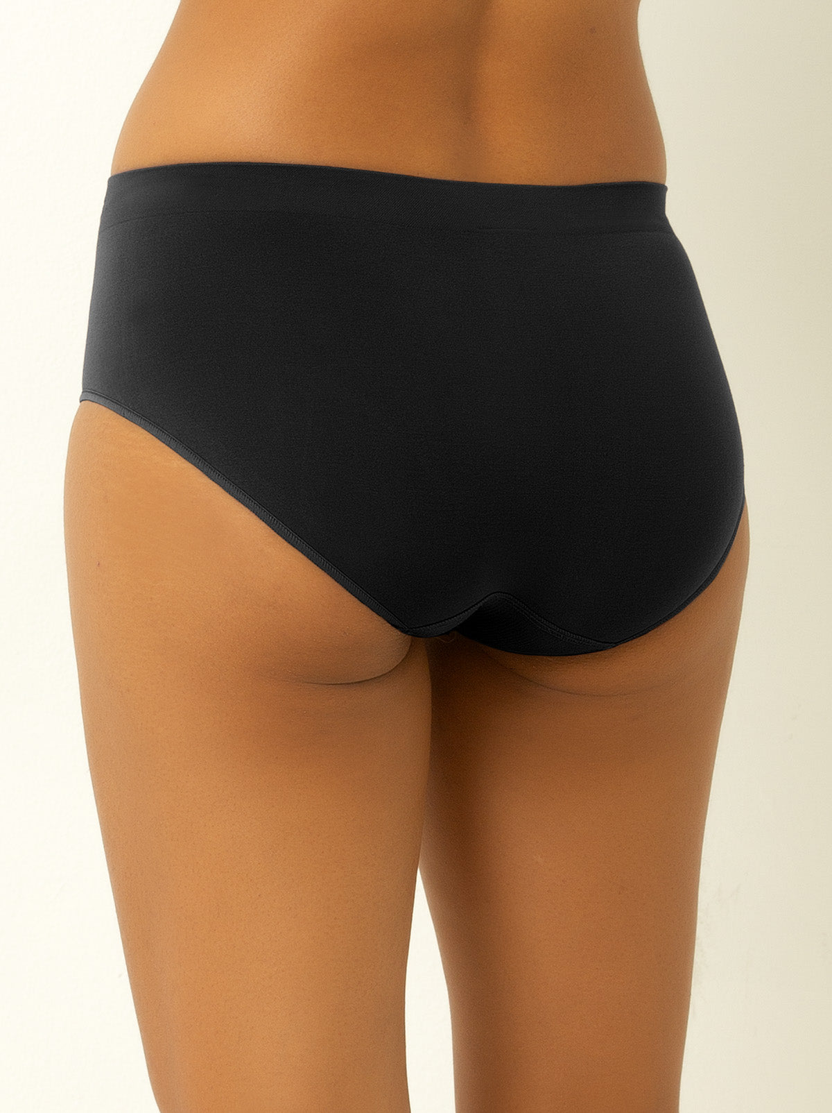 Back shot of female model wearing black colored bikini underwear
