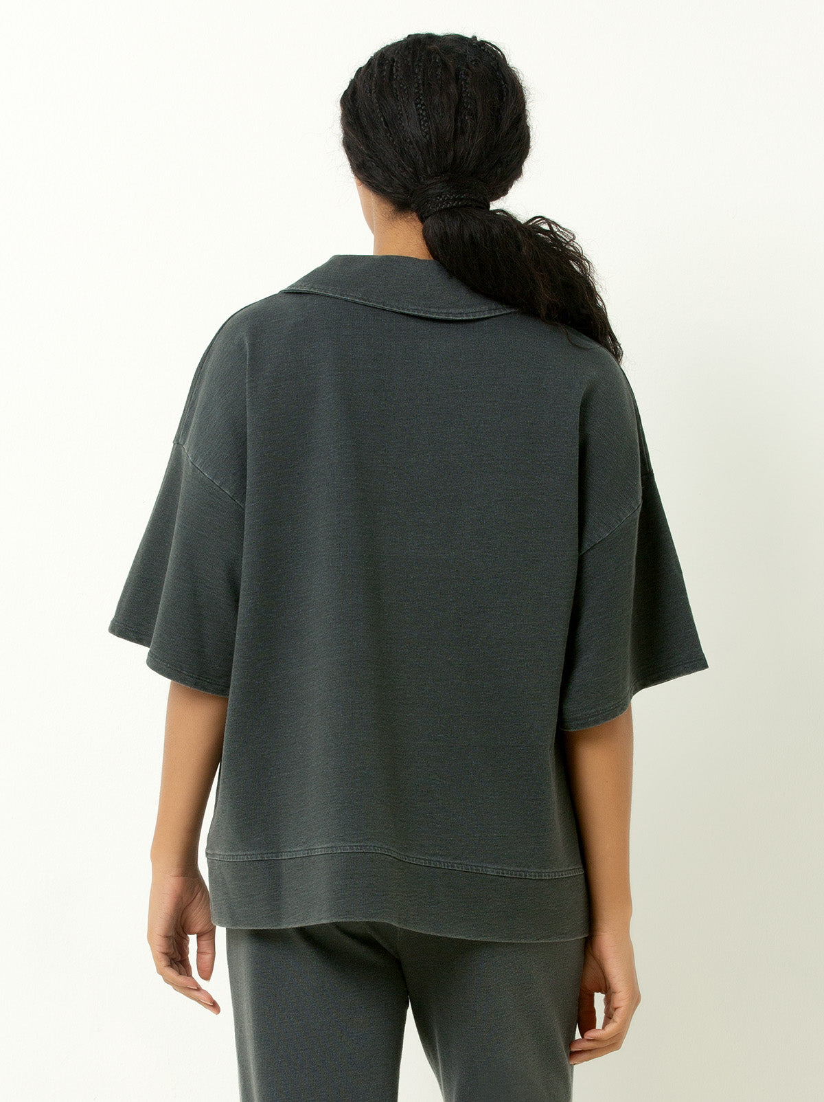 back view of woman wearing elbow length sleeve sweatshirt