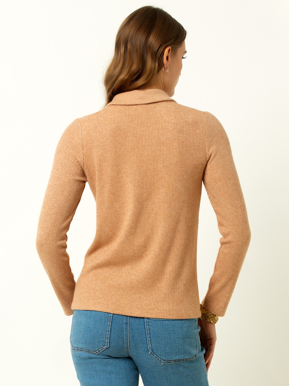 back shot of female model waring a macaroon colored v neck sweater with collar 