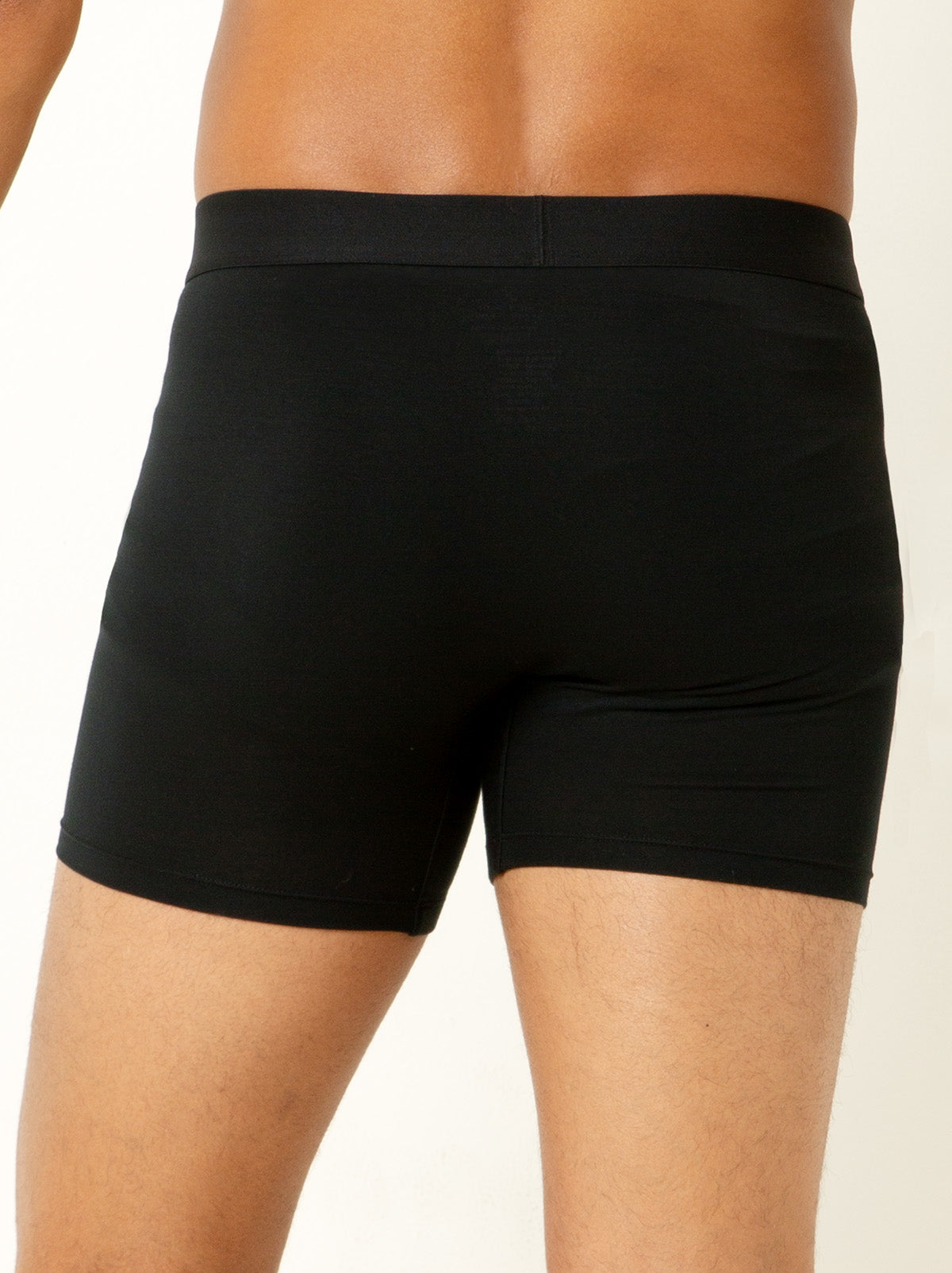 back shot male model wearing black colored boxer briefs 