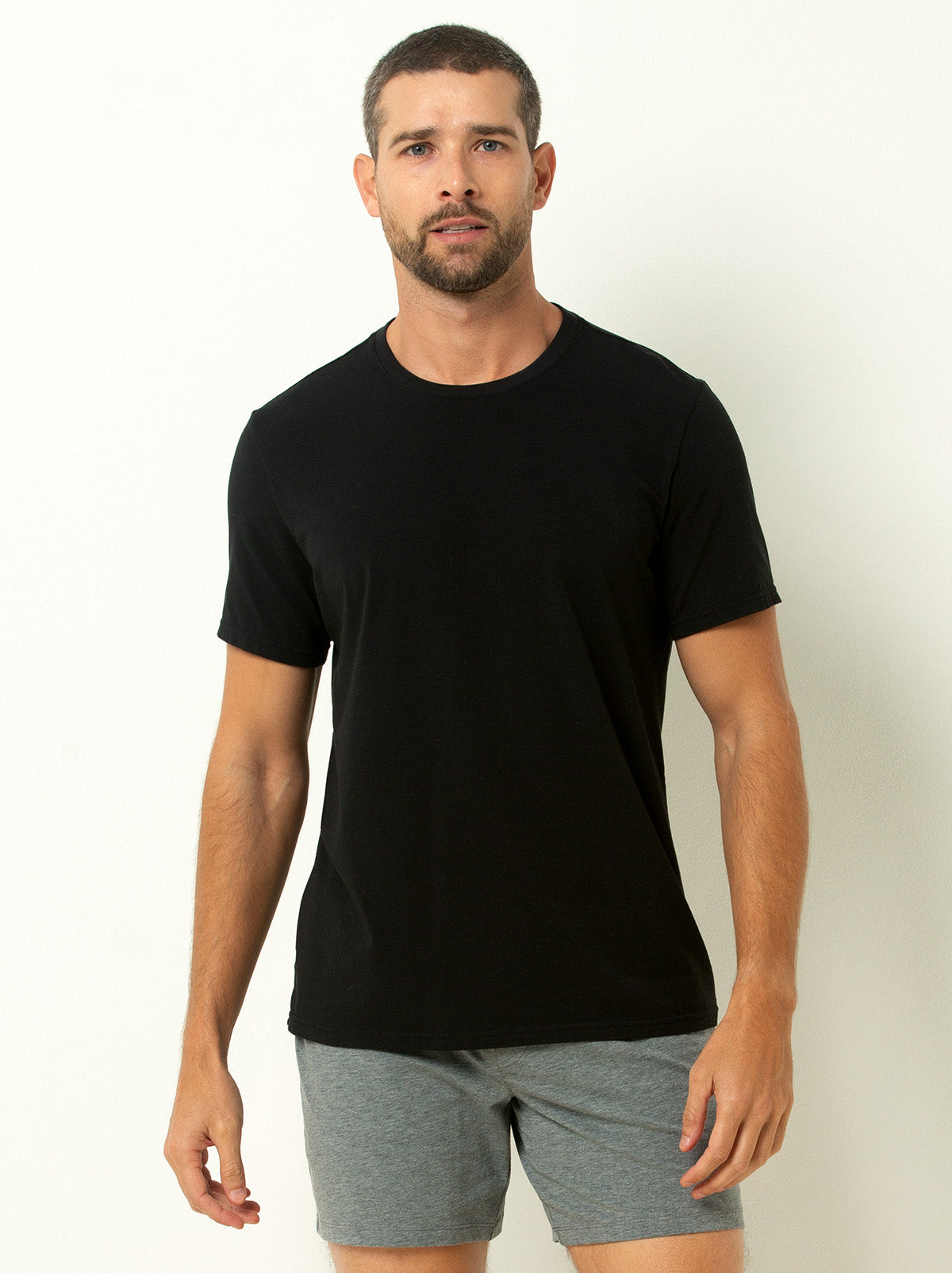 male model wearing black colored crew neck tee