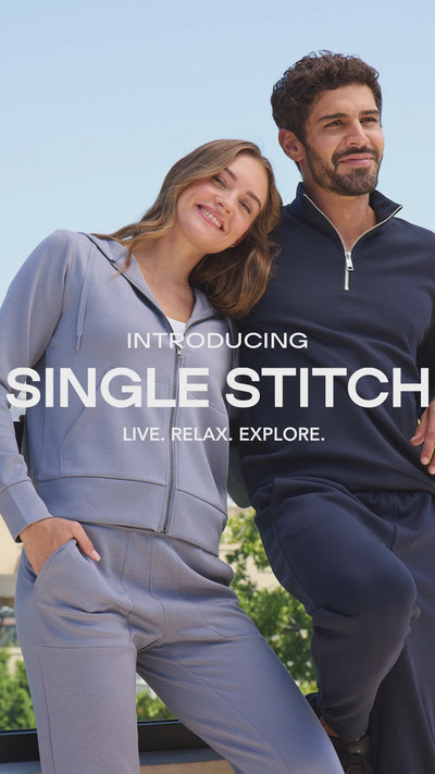 mobile video of female and male models wearing single stitch clothing.